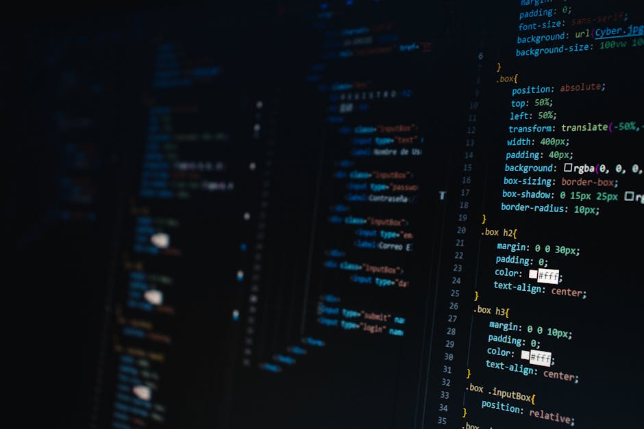 A close-up image of a computer screen displaying lines of colorful code, including various programming commands in green, purple, orange, and blue, set against a dark background; the code is partially